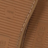 Onderkant van Apollo boots sloffen toont de stevige antislip zool voor veilige grip binnenshuis